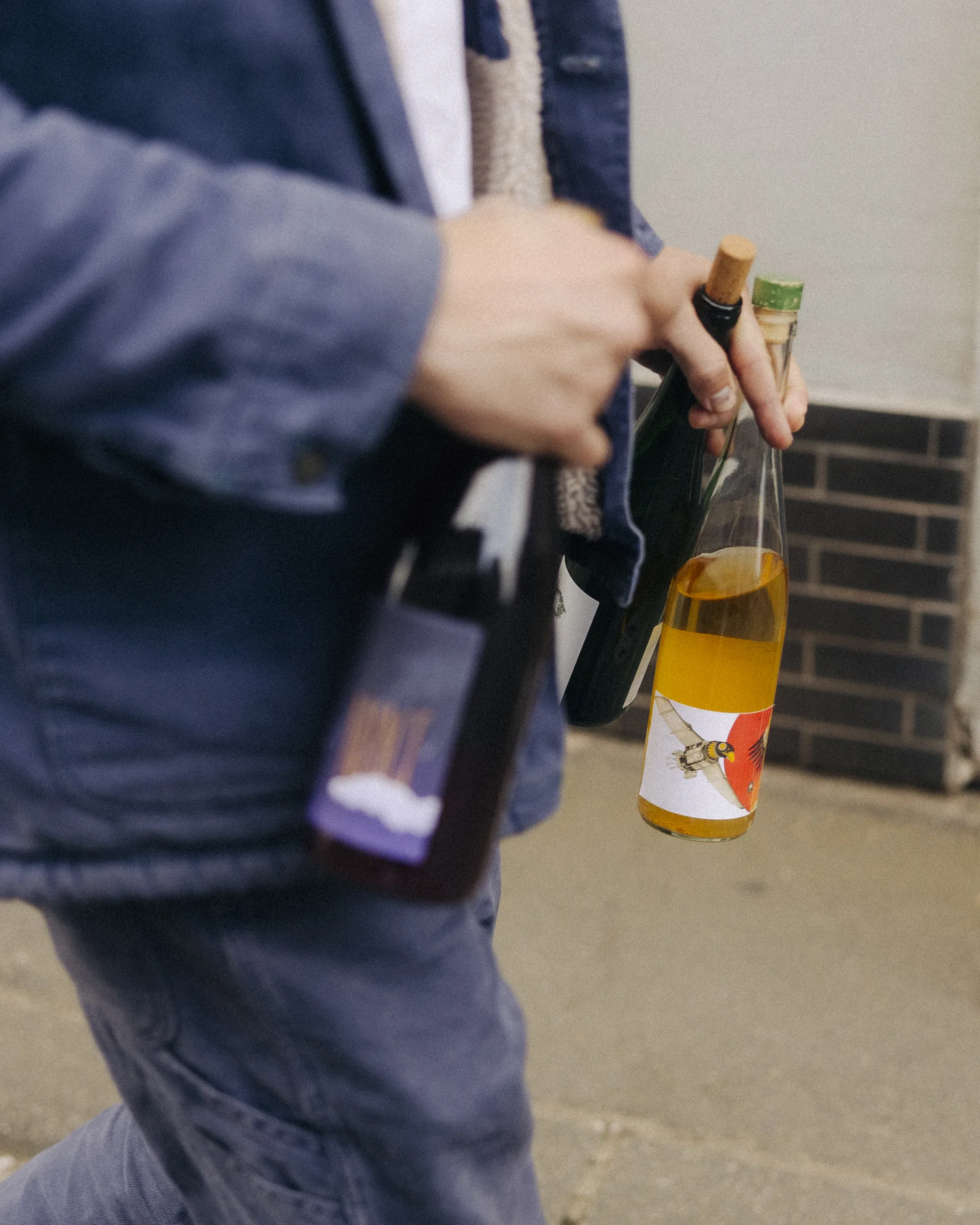 Jan-Philipp carrying wine bottles